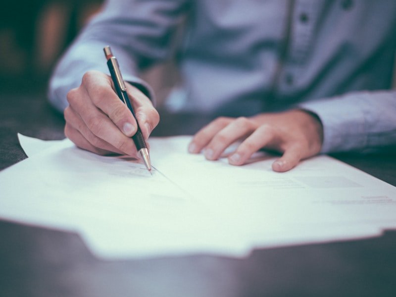 Reviewing a marriage contract document with a pen
